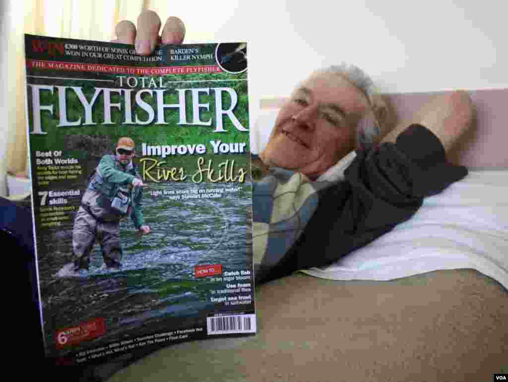 Cunnington reads his favorite sports magazine and remembers when his son was four and came home with two of the largest fish ever caught on the family&#39;s farm. (Photo by Darren Taylor)