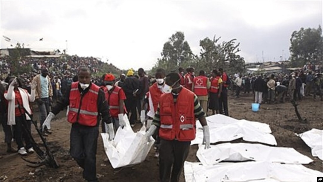 Red Cross workers collect bodies after a pipeline explosion on Monday, Sept. 12, 2011.