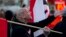 A supporter of the far-right nationalist National Democratic Party of Germany (NPD) attends a rally in Berlin April 13, 2012. Some 50 extreme-right supporters of the NPD marched on Friday through a Berlin suburb, demanding Germany dropped the Euro currenc