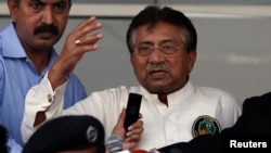 Pakistan's former president, Pervez Musharraf, addresses a group of supporters following his arrival in Karachi March 24, 2013.