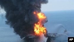 This US Coast Guard image released on April 22, 2010 shows fire boat response crews as they battle the blazing remnants of the off shore oil rig Deepwater Horizon, 21 April 2010.