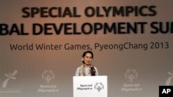 Myanmar opposition leader Aung San Suu Kyi speaks at the Global Development Summit during the 10th Special Olympics World Winter Games in Pyeongchang, South Korea, Wednesday, Jan. 30, 2013. South Korea began showing off its new snow sports mecca with th