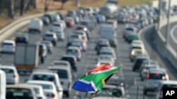 Traffic moves slowly near Soccer City Stadium in Johannesburg on the opening day of the 2010 World Cup football tournament in South Africa, 11 Jun 2010