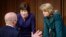 Homeland Security Secretary Alejandro Mayorkas, left, talks with Sen. Susan Collins, R-Maine, center, and Sen. Lisa Murkowski, R-Alaska, right, during a break of the Senate Appropriations committee hearing to examine domestic extremism, Wednesday,…