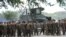 FILE - US marines prepare to board buses outside their temporary base on their way to a nearby air base as the annual US-Philippine joint military exercise winds down at the former US target range in Crow Valley, Capas town, north of Manila on May 15, 2014.