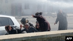 FILE - Turkish riot police use a water canon to disperse protesters during Kurdish activist Zulkuf Gezen's funeral in the Turkish city of Diyarbakir, March 18, 2019.