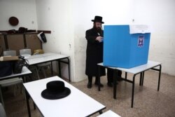 Ultra-orthodox man votes during elections in Bnei Brak, Israel, Monday, March 2, 2020.