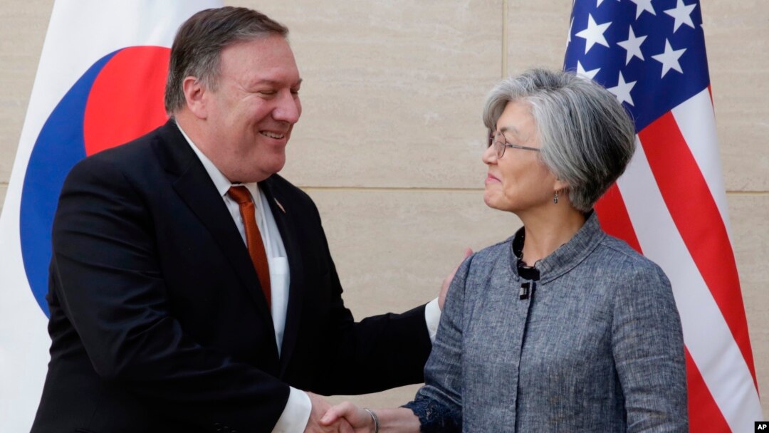 FILE - U.S. Secretary of State Mike Pompeo, left, shakes hands with South Korean Foreign Minister Kang Kyung-wha at South Korea's mission, July 20, 2018, in New York.