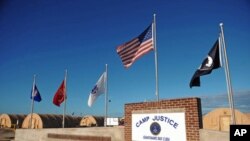 A 'Camp Justice' sign near the high-tech, high-security courtroom, which will hold the trial for the five co-defendants on charges related to the September 11 attacks, at Camp Justice in Guantanamo Bay, December 2008. (file photo)