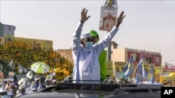 FILE - Chadian President Idriss Deby Itno, center, attends his final campaign rally for the recent elections in N'Djamena, Chad, April 9, 2021. Deby was killed on the battlefield April 20, 2021, in a fight against rebels.