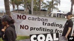 People walk with a coffin as they protest against the usage of coal during a climate change conference at the city of Durban, South Africa, Thursday, Dec 1, 2011. (AP Photo/Schalk van Zuydam)