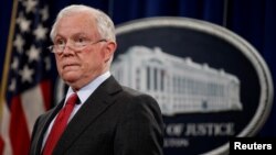 U.S. Attorney General Jeff Sessions stands during a news conference to discuss "efforts to reduce violent crime" at the Department of Justice in Washington, Dec. 15, 2017.