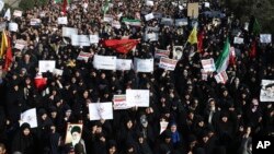 Iranian protesters chant slogans at a rally in Tehran, Iran, Dec. 30, 2017.