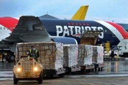 A New England Patriots Boeing jet with a shipment of over one million N95 masks from China, which will be used in Boston and New York to help fight the spread of the coronavirus disease, arrives at Logan Airport, Boston, April 2, 2020.