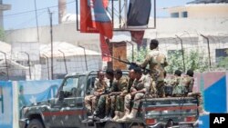 FILE—Somalia security officers patrol near the SYL hotel building which was attacked by al-Shabab Islamic extremist rebels in Mogadishu, Somalia, March 15, 2024