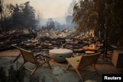 Furniture is pictured, with debris covering the ground, in the Pacific Palisades neighborhood on the west side of Los Angeles, Jan. 9, 2025.