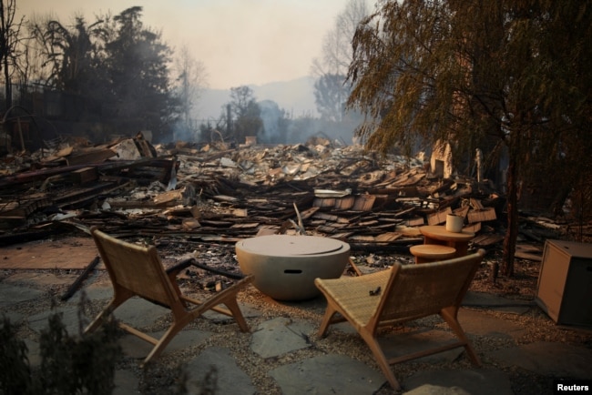 Furniture is pictured, with debris covering the ground, in the Pacific Palisades neighborhood on the west side of Los Angeles, Jan. 9, 2025.