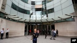 FILE - The main entrance to the headquarters of the BBC in London, Wednesday, July 19, 2017. The publicly funded BBC has published the names and salaries of its highest-earning actors and presenters, Wednesday, compelled by Britain's government to publish the salaries of on-air talent, which had previously been secret, revealing that its highest-paid star, radio host Chris Evans, earns more than 2.2 million pounds ($2.9 million) a year.