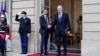 New French prime minister Michel Barnier, right, shakes hands with outgoing prime minister Gabriel Attal during the handover ceremony, Sept. 5, 2024 in Paris. 