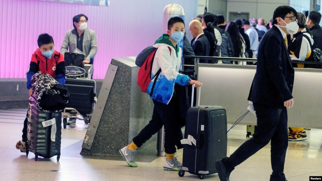 Passengers arrive at LAX from Shanghai, China, after a positive case of the coronavirus was announced in the Orange County suburb of Los Angeles, California, U.S., January 26, 2020.