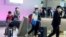 Passengers arrive at LAX from Shanghai, China, after a positive case of the coronavirus was announced in the Orange County suburb of Los Angeles, California, U.S., January 26, 2020.