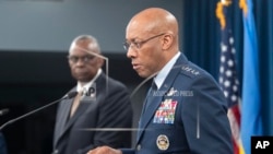 FILE - Chairman of the Joint Chiefs of Staff Gen. CQ Brown Jr. speaks during a press briefing with Defense Secretary Lloyd Austin, left, at the Pentagon near Washington, April 26, 2024.