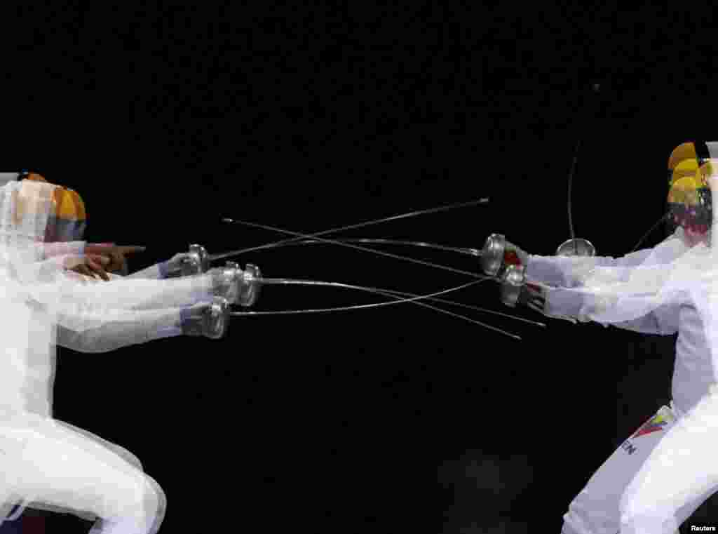 Venezuela&#39;s Ruben Limardo competes against his brother Jesus Limardo during the Fencing Men&#39;s Epee Individual Gold Medal Bout at the Lima 2019 Pan-American Games in Lima, Peru, Aug. 5, 2019.