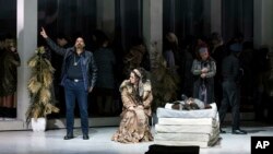 FILE - Actors perform a scene during the rehearsal of George Gershwin's opera "Porgy and Bess" at the Erkel Theatre in Budapest, Hungary, Jan. 27, 2018.
