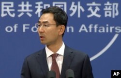 FILE - Chinese Foreign Ministry spokesperson Geng Shuang speaks during a press briefing in Beijing, July 11, 2017, in this image made from video.