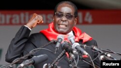 FILE: Zimbabwe President Robert Mugabe addresses supporters during celebrations to mark his 90th birthday in Marondera about 80km ( 50 miles) east of the capital Harare, Feb. 23, 2014. Mugabe turned 90 on February 21. 