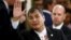 FILE - Ecuador's President Rafael Correa waves as he arrives at Casa Rosada Presidential Palace in Buenos Aires, Argentina, Dec.10, 2015.