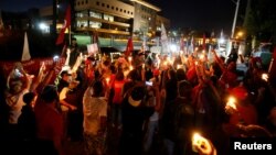 Supporters of former Brazilian president Luiz Inacio Lula da Silva attend a vigil outside the Federal Police Superintendence in Curitiba, Brazil, Aug. 31, 2018.