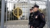 FILE - Police guard the Moscow City Court entrance in Moscow, April 17, 2023. Russian prosecutors have asked for a seven-year sentence for U.S. citizen Stephen Hubbard, who is accused of fighting as a mercenary in Ukraine against Russia, according to Russian news agencies.