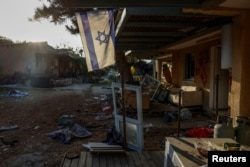 FILE - Damage is pictured in Kibbutz Kfar Aza following the October attack by Hamas gunmen from the Gaza Strip, in southern Israel, November 5, 2023.