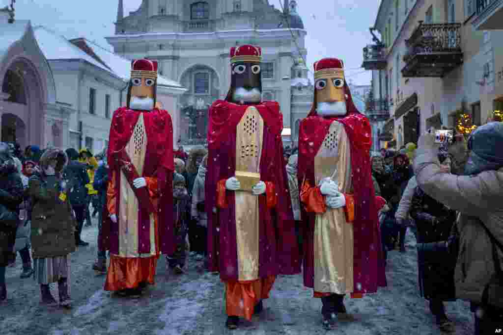 Lithuanians dressed as the Three Kings parade during the Epiphany Day celebrations in Vilnius, Lithuania.