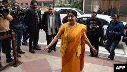 FILE - Indian Foreign Minister Sushma Swaraj arrives at the parliament building in New Delhi, Jan. 31, 2019. 