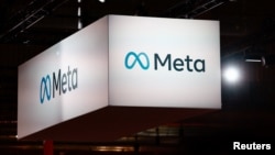 FILE: Meta corporate logo on display at the VivaTech conference dedicated to innovation and startups in Paris. Taken June 14, 2023.