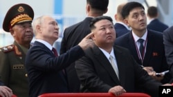 Russian President Vladimir Putin and North Korea's leader Kim Jong Un examine a launch pad during their meeting at the Vostochny cosmodrome outside the city of Tsiolkovsky, on Wednesday, Sept. 13, 2023. (Mikhail Metzel, Sputnik, Kremlin Pool Photo via AP)