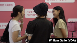 Lee Chae-rin, a Maria Hospital employee, consults with visitors at a pop-up store in Seoul, Aug. 23, 2024. The clinic was aimed at educating young women about egg-freezing.