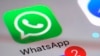 FILE - The WhatsApp communications app is seen on a smartphone in New York, March 10, 2017. Iran's top council responsible for safeguarding the internet voted Tuesday to lift a ban on the popular messaging application.