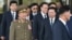North Korean Hwang Pyong-So (2L), director of the military's General Political Bureau, the top military post in North Korea, walks with other officials as they leave a meeting with South Korean Unification Minister Ryoo Kihl-Jae, on the sidelines of the ongoing Asian Games, Oct. 4, 2014.