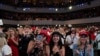 FILE - Supporters of President Donald Trump cheer as he arrives to a group of young Republicans at Dream City Church, in Phoenix, June 23, 2020.