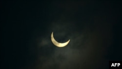 The moon partially covers the sun during an annual solar eclipse as seen from Siliguri, India, June 21, 2020.