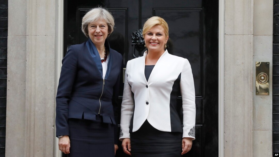 Britain's Prime Minister Theresa May, left, welcomes President Kolinda Grabar-Kitarovic of Croatia to No 10 Downing Street in London, Oct. 11, 2016.
