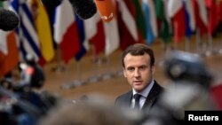 French President Emmanuel Macron arrives to attend the EU summit in Brussels, Belgium, Dec. 14, 2017.