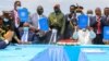 FILE - Sudan's transitional authorities and a rebel alliance sign a peace deal initialed in August that aims to put an end to the country's decades-long civil wars, in a televised ceremony in Juba, South Sudan, Oct. 3, 2020.