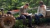 Gerald Flynn conducts an interview with community forest patrolers in Cambodia's Chhaeb-Preah Roka Wildlife Sanctuary while investigating illegal logging in 2023. (Chasing Deforestation/Mongabay photo)