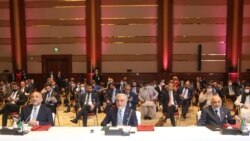 Abdullah Abdullah, center, chairman of Afghanistan's High Council for National Reconciliation, attends the opening session of peace talks between the Afghan government and the Taliban, in Doha, Qatar, Sept. 12, 2020.