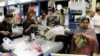 People shop at a Nakumatt store in an upmarket area of Nairobi, Kenya, Jan. 5, 2011.