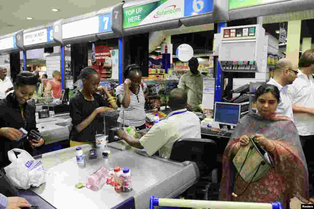 People shop at a Nakumatt store in an upmarket area of Nairobi, Kenya, Jan. 5, 2011.